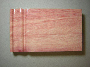 PROTECTIVE LAMINATE FOR INKJET PRINTABLE SURFACES IN WOOD AND PLASTICS APPLICATIONS AND FAUX WOOD, PLASTIC, WALL AND PANEL COVERINGS